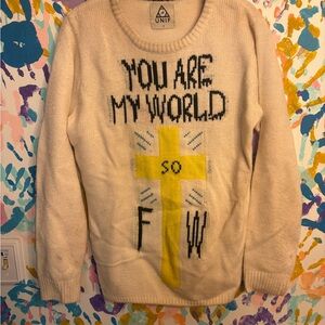 UNIF Cream Sweater with Yellow Cross and Text